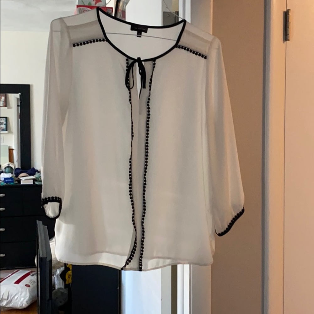 A white and black blouse size medium.
